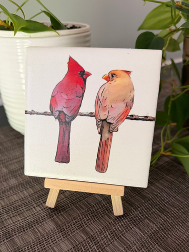 Male and female cardinal ceramic tile on natural wood easel