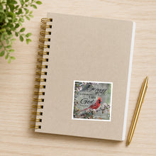 Cardinal on dogwood Be Still waterproof sticker on notebook